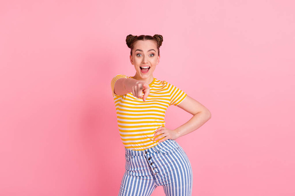 Photo of optimistic nice brunette lady point camera wear t-shirt pants isolated on pink background - Fotó, kép