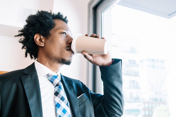 Businessman drinking coffee on a break from work. - Fotó, kép