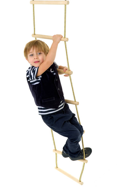 Cute little boy climbing rope ladder - Foto, Imagem