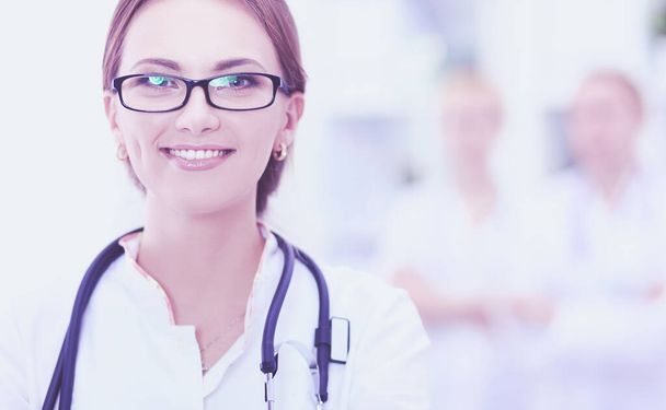 Portrait of woman doctor standing at hospital - Фото, зображення