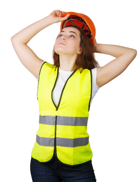 Girl wears a vest builder helmet on his head. Isolated.  - Photo, Image