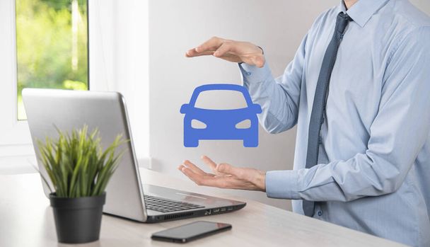 Digital composite of Man holding car icon.Car automobile insurance and car services concept. Businessman with offering gesture and icon of car. - Photo, Image