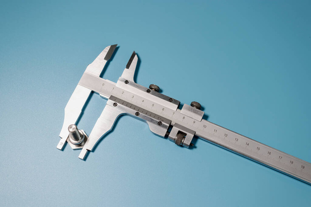 Caliper is a highly accurate measurement tool. The exact size of the parts. Professional tool - Photo, Image