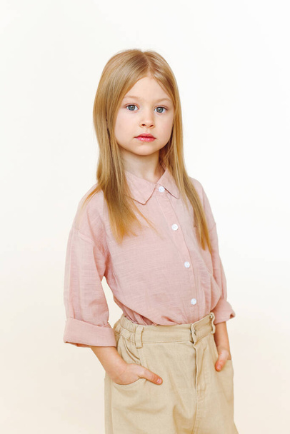 portrait of a little fashionable girl in the studio - Zdjęcie, obraz