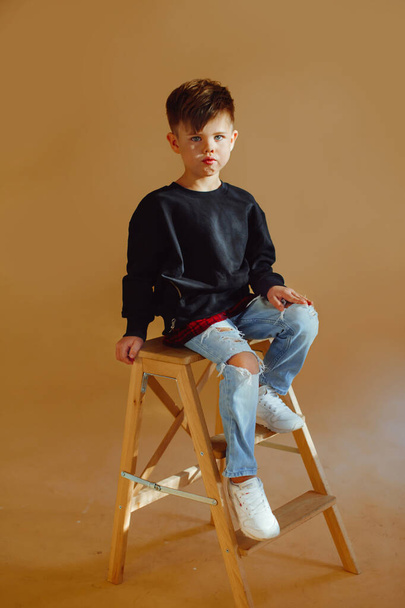 portrait of a fashionable little boy in the studio - 写真・画像