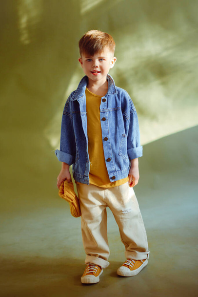 portrait of a fashionable little boy in the studio - Photo, image