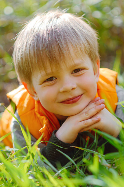 portrait of a fashionable little boy in nature - Fotó, kép