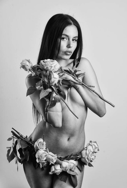 beautiful naked body. sexy naked woman hold rose flower. woman getting spa treatment. beauty salon. romantic or love date concept. skincare with natural cosmetics. passion. Green plant - Fotografie, Obrázek