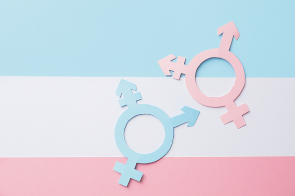 Symbols of transgender on color background - Φωτογραφία, εικόνα