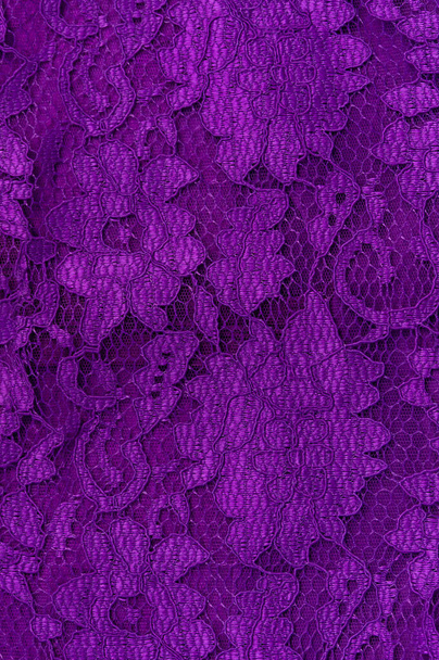Purple lace fabric texture top view. Violet background. Fashion trendy color feminine lacy dress flat lay, female blog glossy floral backdrop text sign design. Girly abstract wallpaper,textile surface - Photo, Image