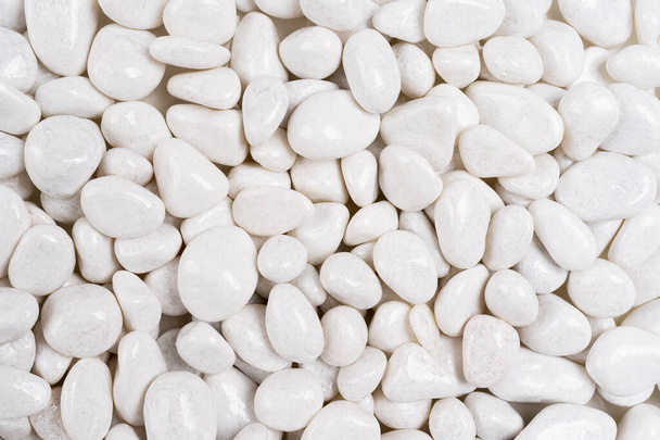 close-up of few white stones, front view in high resolution, White stone on white paper background. Background and texture of floor decoration in garden by white stones. design or background use - Foto, Imagem