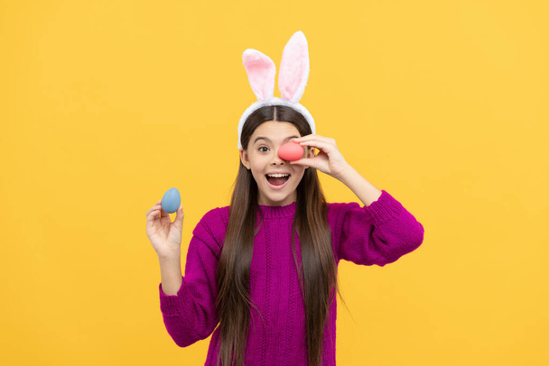 surprised easter teen girl in funny bunny ears hold painted eggs, happy easter. - Foto, Imagem