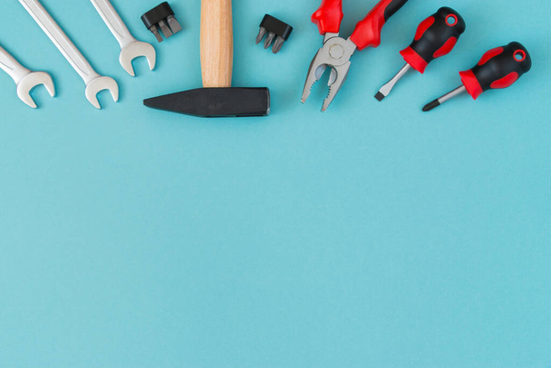Working tools on a blue background. Father's day celebration concept. Copy plasticity for text. - 写真・画像