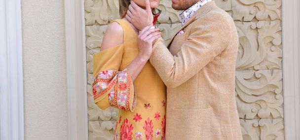 a young couple dressed in yellow is having a photo shooting - Photo, Image