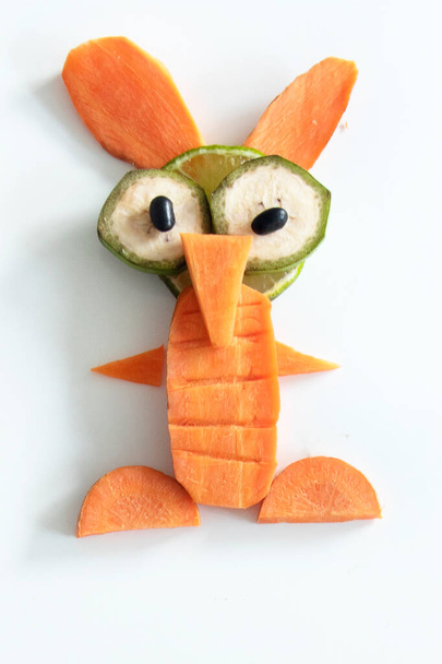 funny creature made with carrot, lime and banana - Foto, Imagem