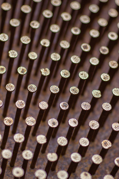Rusty nail grid close-up background, shifting to soft round shapes - Valokuva, kuva