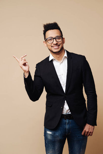 Handsome man pointing to the side with space for text - Photo, Image