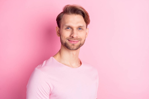 Profile portrait of half turned satisfied man look camera smile isolated on pastel pink color background - Фото, изображение