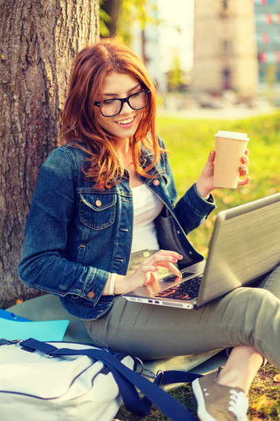 teenager in eyeglasses with laptop and coffee - Valokuva, kuva