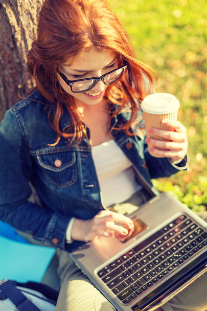 teenager in eyeglasses with laptop and coffee - Zdjęcie, obraz