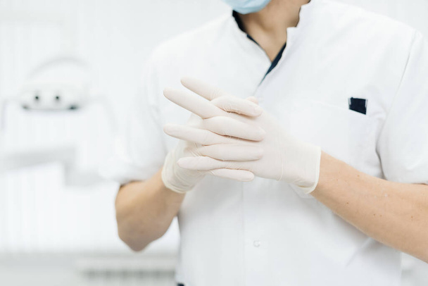 Closeup doctor hands in gloves - Foto, Imagen
