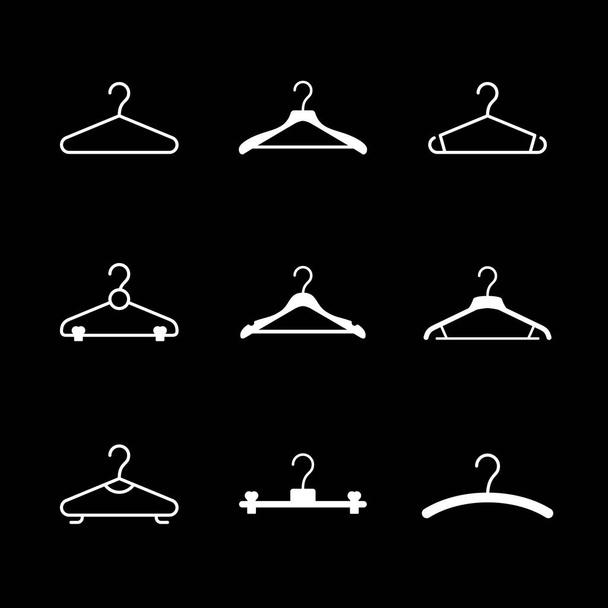Set glyph icons of clothes hanger isolated on black - Vector, Image