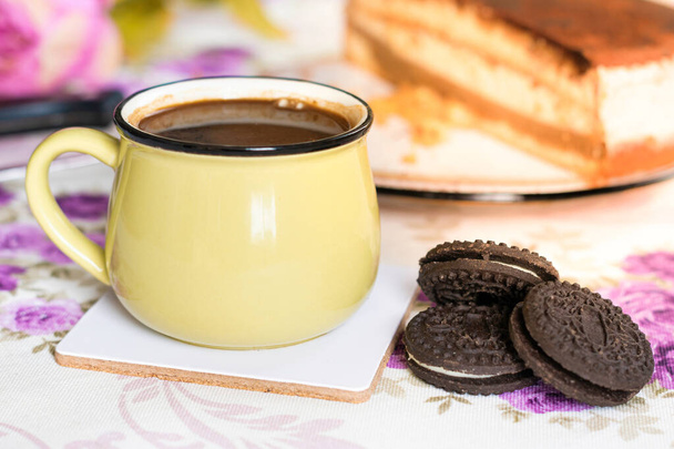 Chocolate sandwich cookies and coffee - Photo, Image