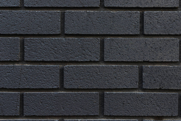 Primer plano de fondo de textura de pared de ladrillo negro. - Foto, imagen