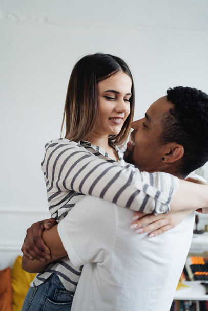 Mixed race couple dancing at home - Photo, Image