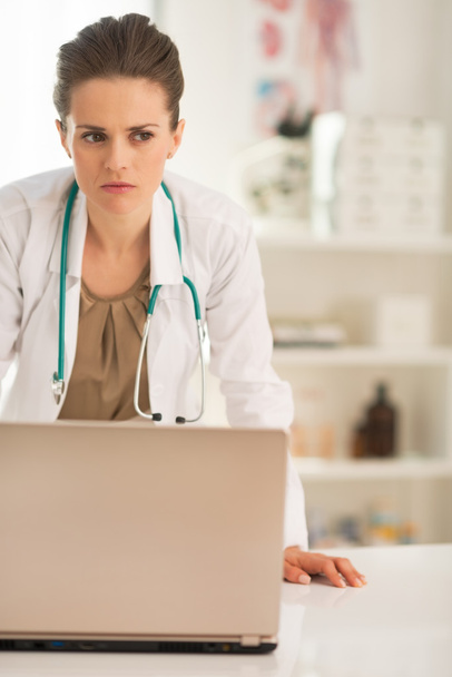 Concerned medical doctor with laptop - Φωτογραφία, εικόνα