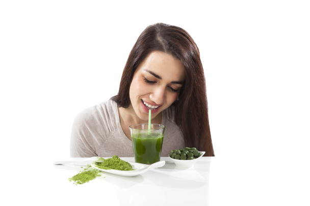 Beautiful girl drinking green juice. - Photo, Image