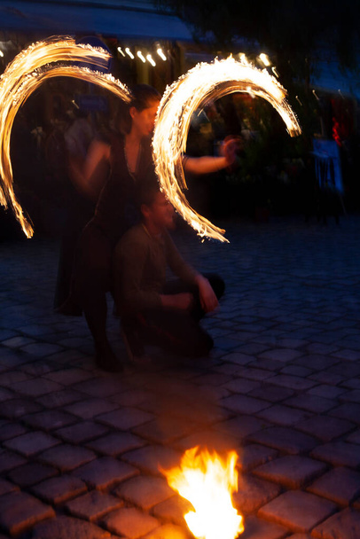fire show on the street of the ancient city in the evening - Photo, Image