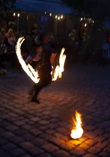 fire show on the street of the ancient city in the evening - Photo, Image