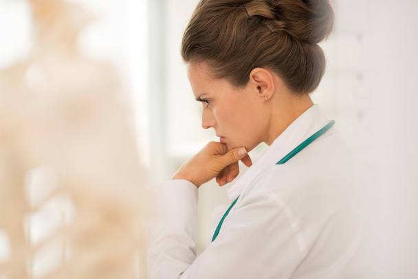 Thoughtful medical doctor woman - 写真・画像