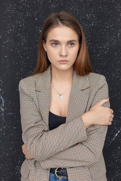 young attractive caucasian woman with long hair in black top and suit jacket - Φωτογραφία, εικόνα