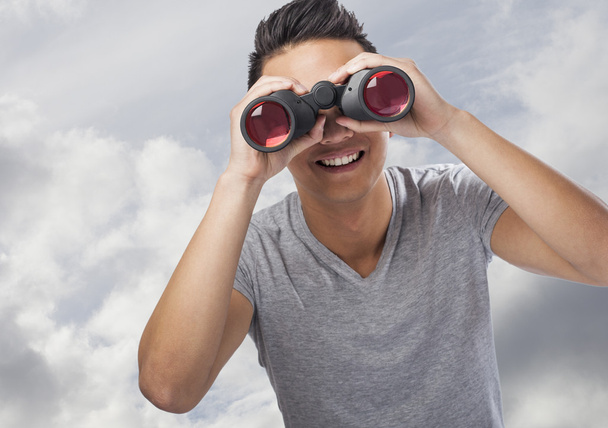 Man looking through binoculars - Photo, Image