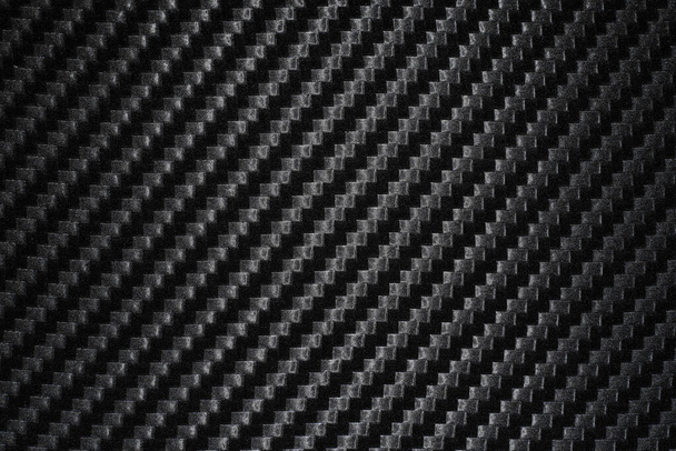 Textur aus Carbon-Vinylfolie in schwarzer Farbe für die Innenverklebung - Foto, Bild