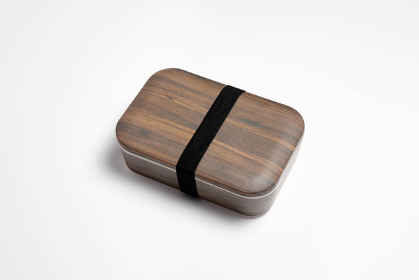 Wooden box with rubber band isolated on white background. High-resolution photo. - Valokuva, kuva
