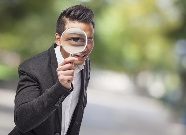 Man with magnifying glass - Photo, Image