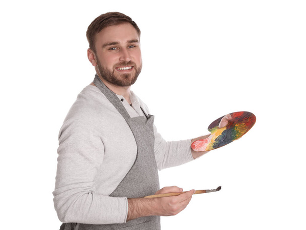 Homem com ferramentas de pintura em fundo branco. Jovem artista - Foto, Imagem