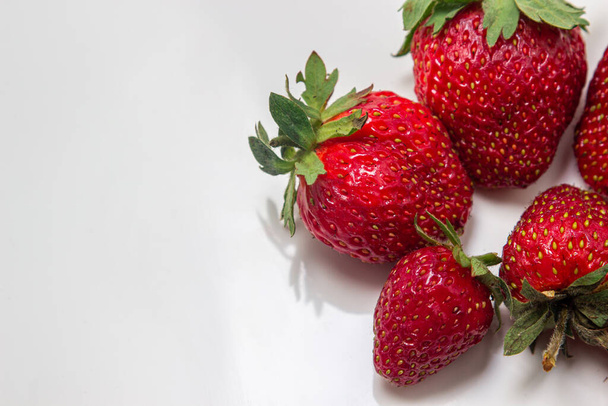 Strawberries on a white background. Fresh ripe strawberries. Healthy diet. - 写真・画像