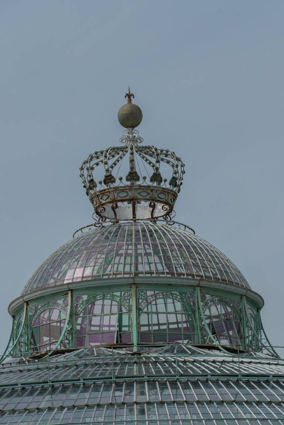 Brussels, Belgium, May 28, 2021: Classically styled greenhouses designed by Alphonse Balat in 1873 with pavilions, domes and galleries. - Fotó, kép