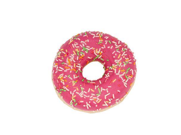 Traditional donut top view. A glamorous doughnut in pink frosting topped with a colorful pastry sprinkle. Photo isolated on a white background for design and advertising. - Foto, Imagem