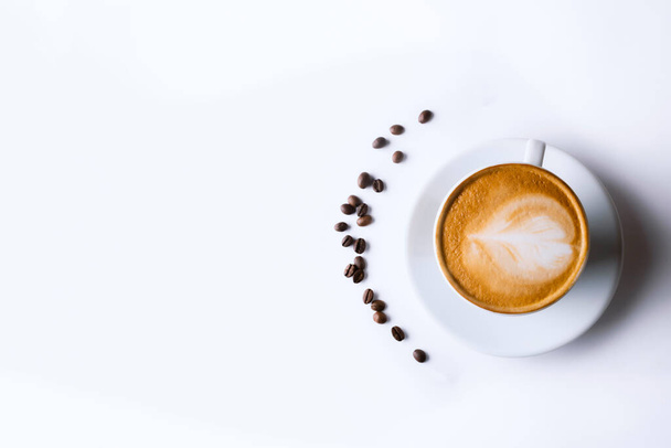 Latte coffee in white coffee cup with plate on white background. cappuccino coffee - 写真・画像