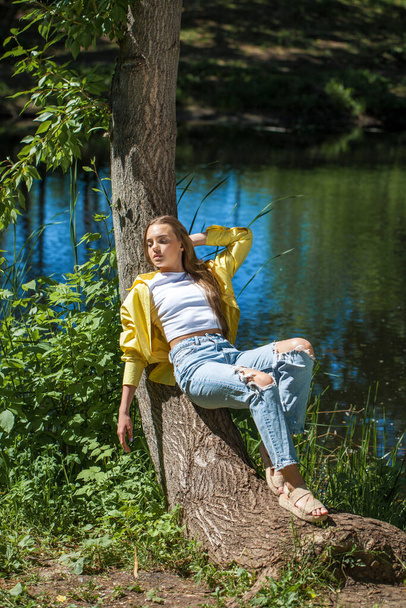 Portrait of a Young beautiful blonde girl in yellow shirt - Photo, image