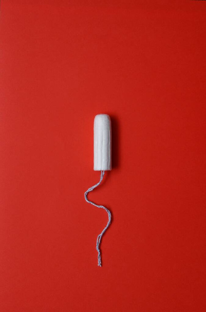 white tampon with blue thread - Photo, Image