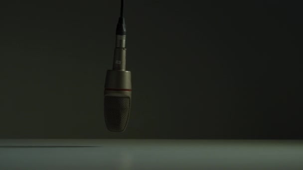 Microphone swinging in a studio - Filmati, video