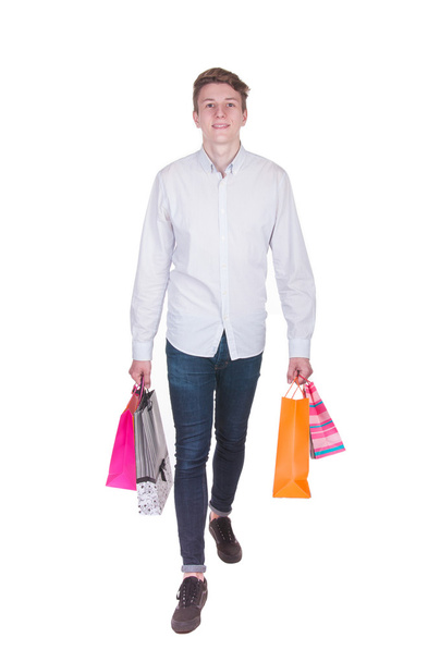 Young man with full of bags - Foto, imagen