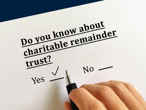 One person is answering question about last will. He knows about charitable remainder trust - Photo, Image
