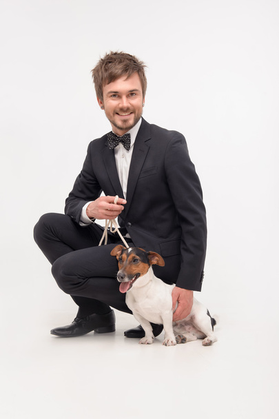 Isolated portrait of owner with his dog - Foto, afbeelding